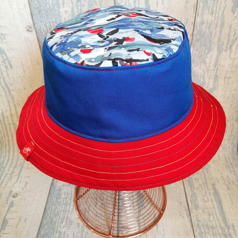 Reversible swimmer's festival bucket hat featuring swimmers