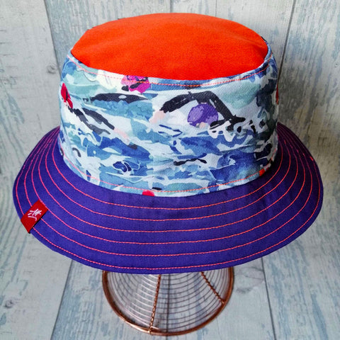 Reversible swimmer's festival bucket hat in purple and orange