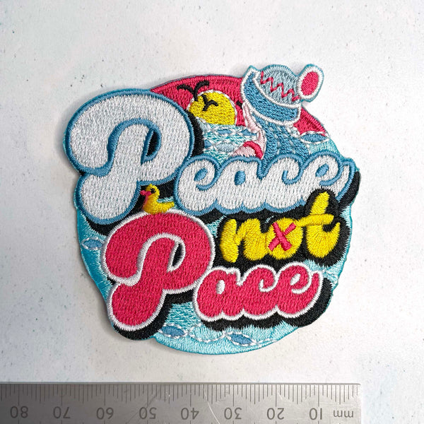 Embroidered iron-on patch. Peace Not Pace