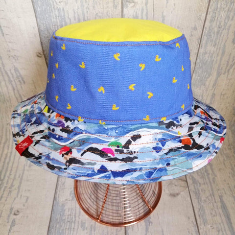 Reversible swimmer's festival bucket hat in cornflower blue, neon yellow and red