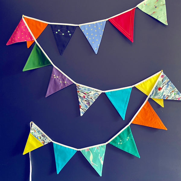 Exquisitely made artisan bunting featuring swimmers