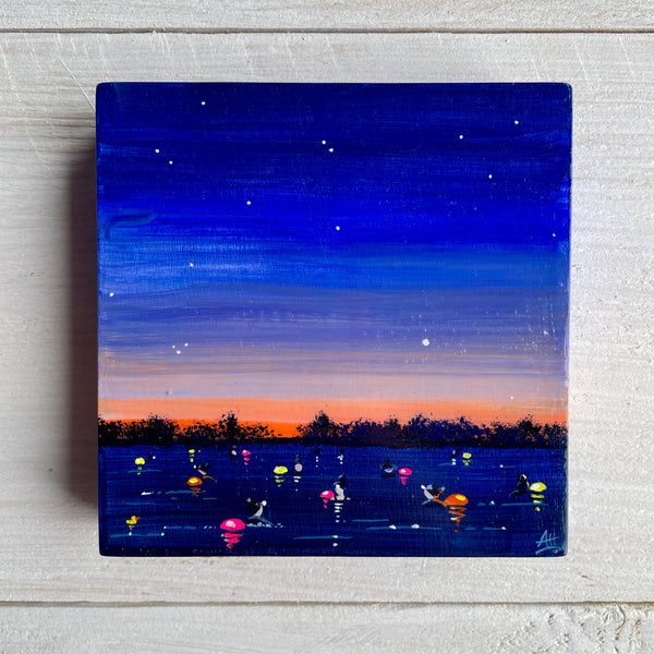 Painting of a night scene with swimmers and colorful lights on water and a starry sky.