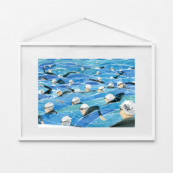 Framed A4 art print of the Great North Swim mass start, showing swimmers in white swim caps and wetsuits in open water. Print shown in a white frame (not included).