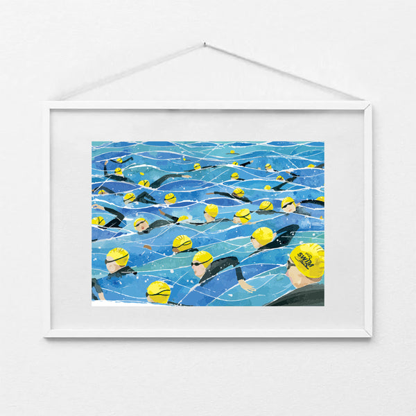 Framed A4 art print of the Great North Swim mass start, showing swimmers in yellow swim caps and wetsuits in open water. Print shown in a white frame (not included).