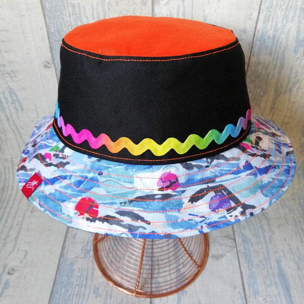 Striking swimmer's festival bucket hat in black and multi colours