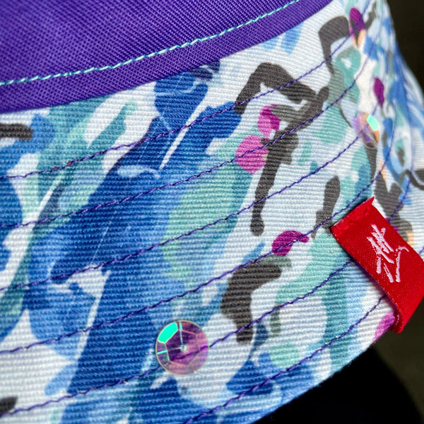 Reversible festival bucket hat with purple swim caps design