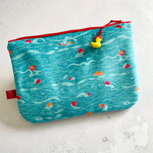 Small illustrated velvet pouch. Outdoor Swimmers design