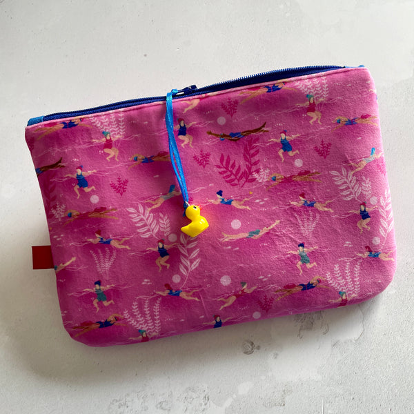 Small illustrated pink velvet pouch. Ladies Wot Swim design