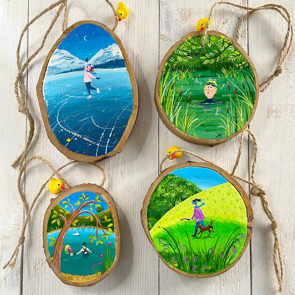 Set of four original illustrated wood slice hanging decorations