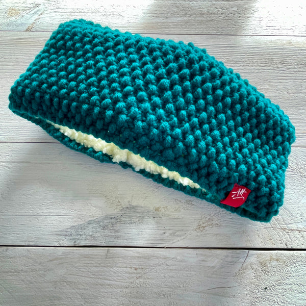 Teal knitted headband with cream sherpa fleece lining