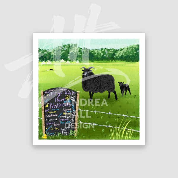 A square art print featuring a watercolor-style illustration of a black sheep and a lamb in a green field, with a chalkboard sign in the foreground. The print is shown centered on a light gray background.