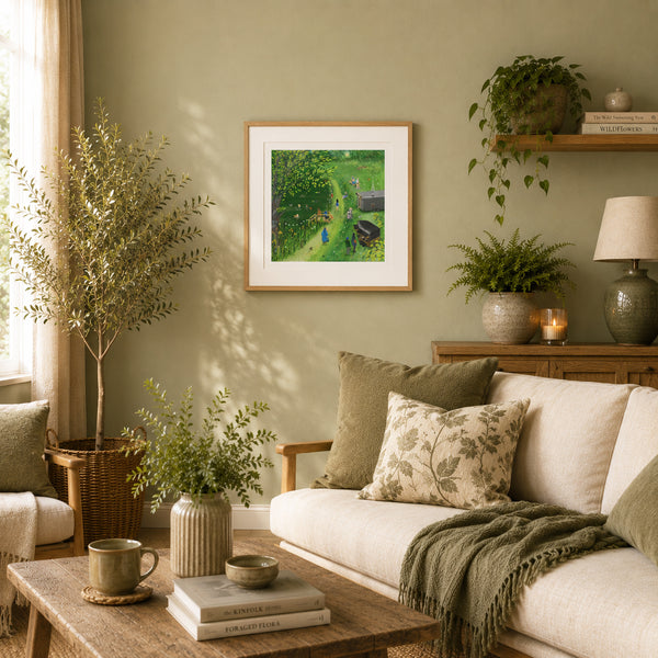 A framed art print depicting wild swimmers at Swillington Wilds, styled on a sage green wall above a beige sofa in a cozy living room setting.