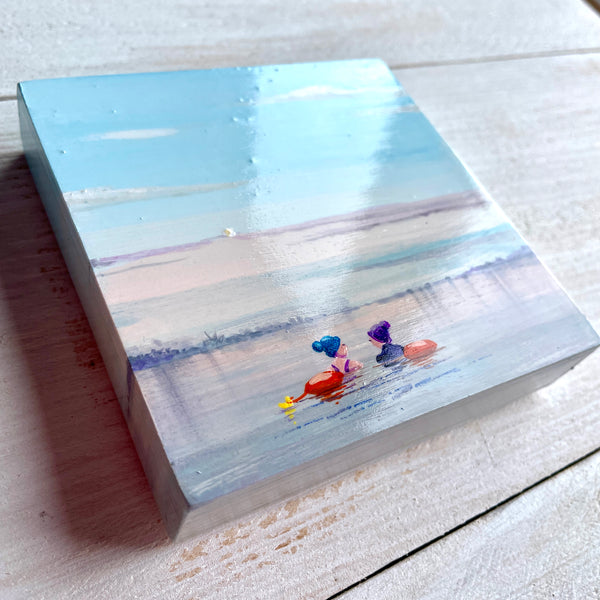 Small painting of two swimmers in a misty lake
