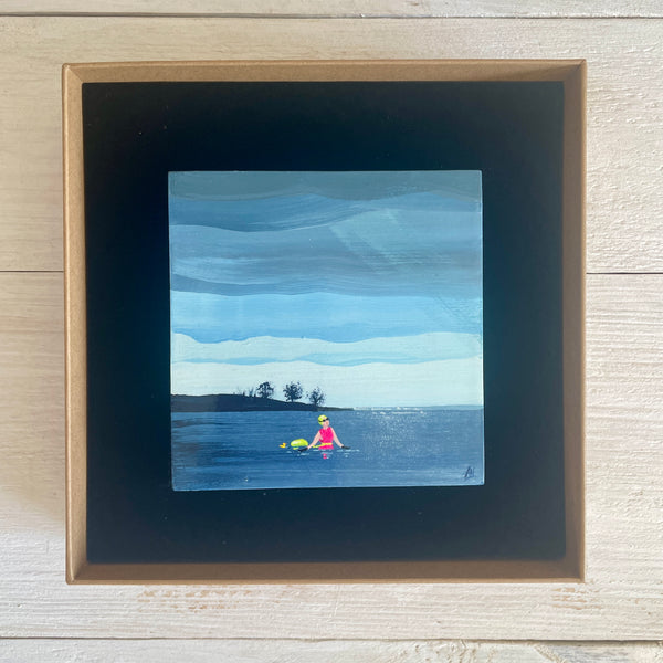 Boxed painting of a swimmer in a lake with a small island in the background.