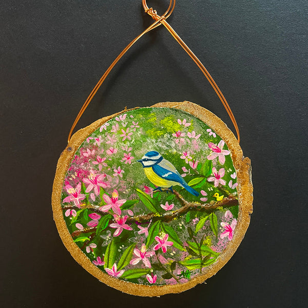 Blue Tit with Blossom original miniature painting by Andrea Hall, hand-painted on a natural wood slice with pink blossom and a tiny blue tit.