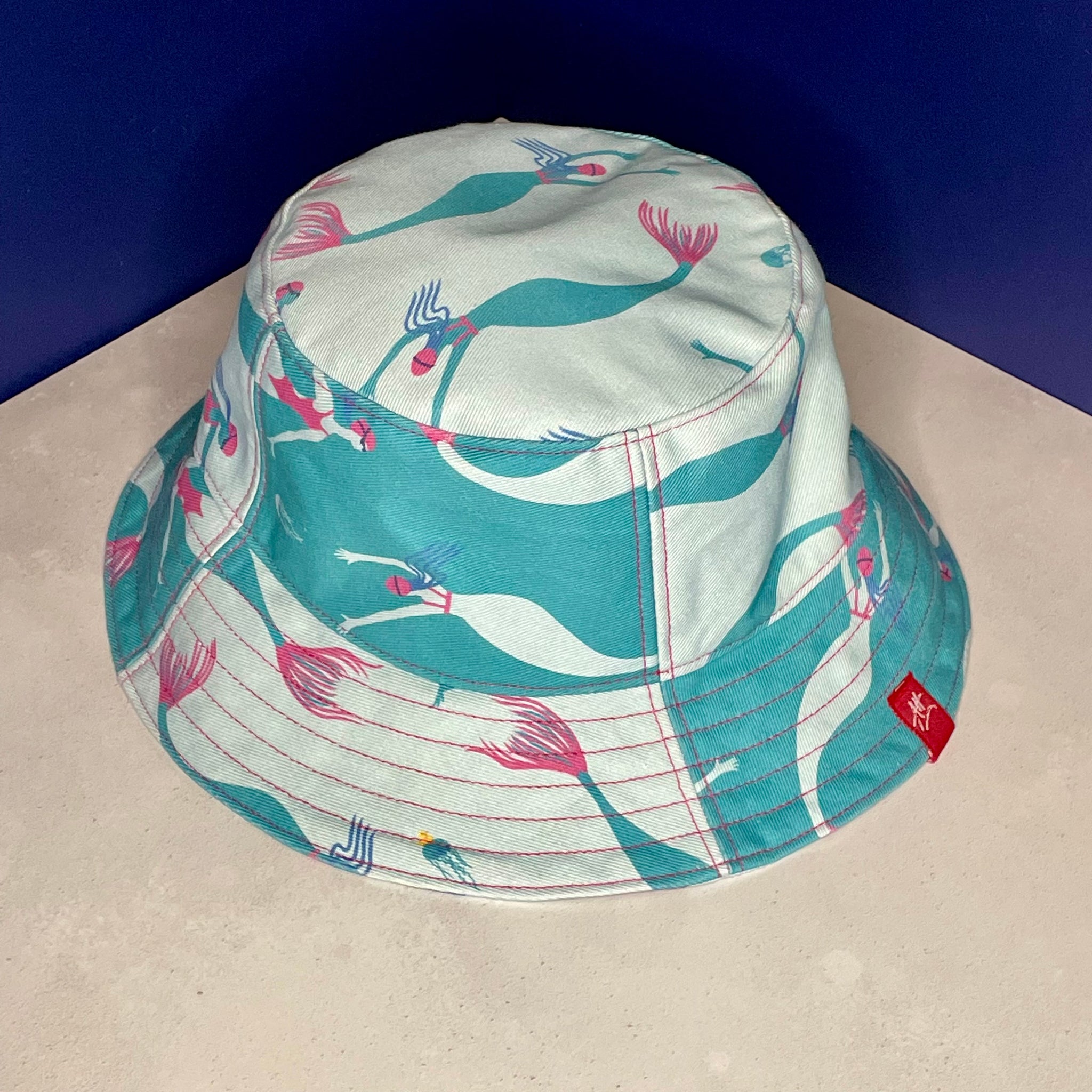 Reversible festival bucket hat. Blue and turquoise Swimming Mermaid design