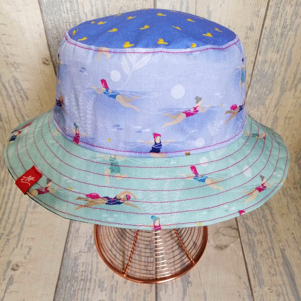 Reversible swimmer's festival bucket hat in cornflower blue, navy and duck-egg