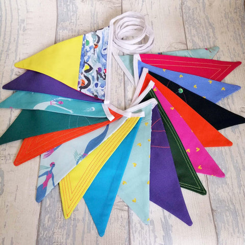 Exquisitely made artisan bunting featuring swimmers