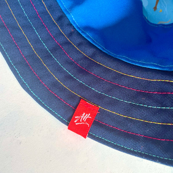 Reversible swimmer's festival bucket hat in cornflower blue, navy and duck-egg