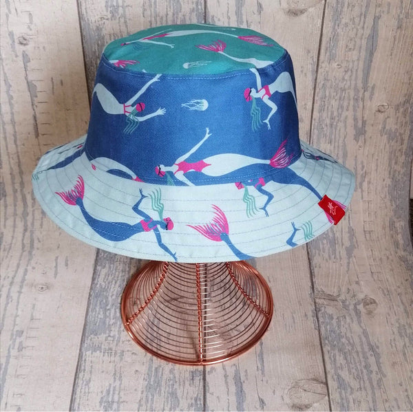 Reversible festival bucket hat. Patchwork blue and turquoise Swimming Mermaid design