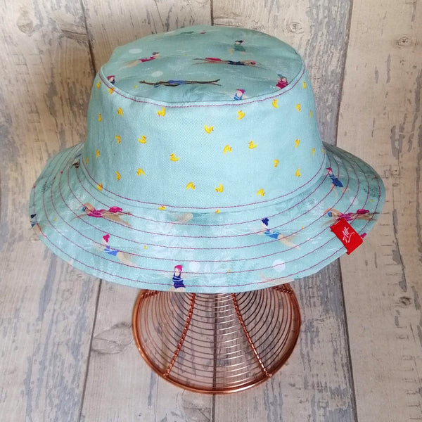 Reversible festival bucket hat with swimming ladies design in Duck Egg/Green