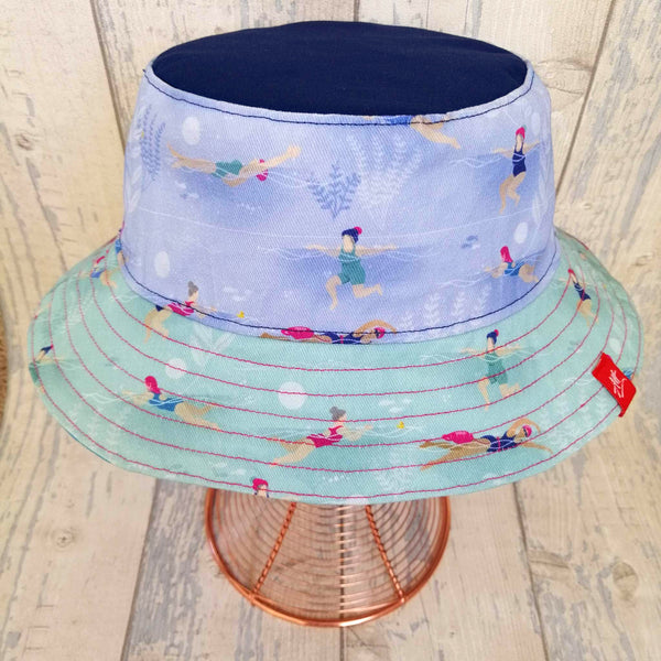 Reversible swimmer's festival bucket hat in all the blues with little swimmers