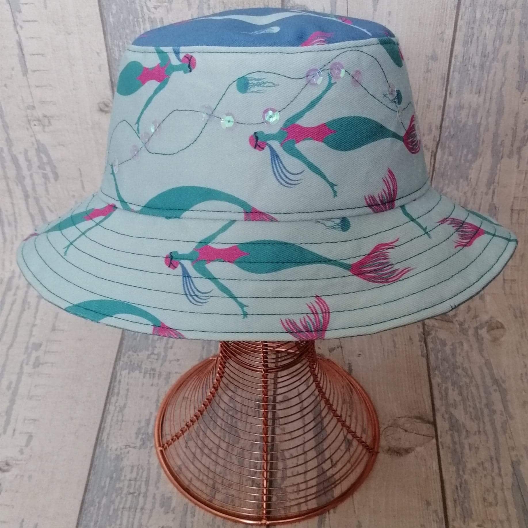 Reversible festival bucket hat. Blue and turquoise Swimming Mermaid design with sequins