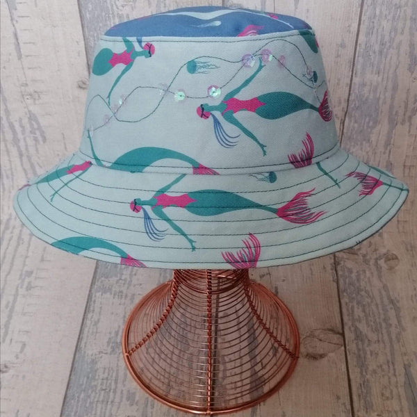 Reversible festival bucket hat. Blue and turquoise Swimming Mermaid design with sequins
